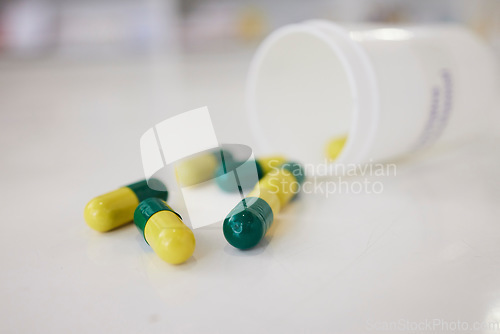 Image of Pills, medication and capsules of pharmaceutical drugs on table for cure, pain or remedy at the clinic. Closeup of healthcare or medical tablets on desk at pharmacy for products, dose or inventory