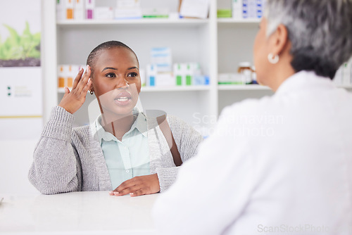 Image of Black woman, patient and doctor at pharmacy for consultation, checkup or advice at store. African female person talking to medical or healthcare professional for pharmaceutical cure or drug at clinic