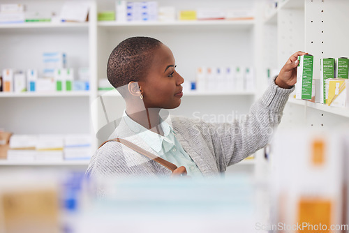 Image of Medicine, shelf and shopping with black woman in pharmacy for medical, pills and information. Healthcare, product and retail with female customer and box for inventory, wellness and supplements