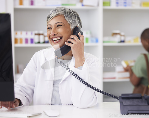 Image of Pharmacist, conversation and customer service with telephone for call with computer. Female chemist, working and online for communication for job with tech for help with medicine at drugstore.