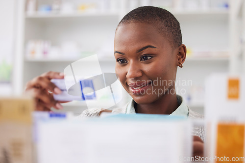 Image of Medicine, pills and shopping with black woman in pharmacy for medical, search and information. Healthcare, product and retail with female customer and box for inventory, wellness and supplements