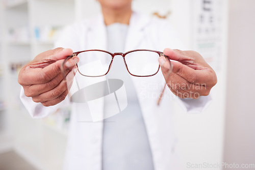 Image of Glasses in hands, vision and eye care, health with eyesight test and optometry, prescription lens and designer frame. Ophthalmology, focus and healthcare, person in optometrist clinic and eyewear