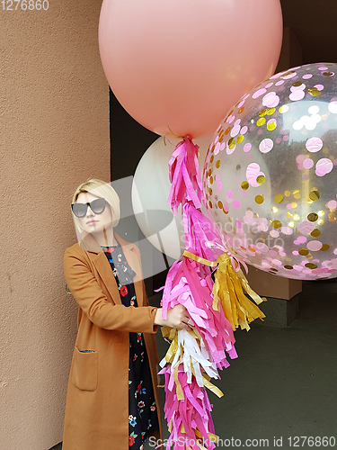 Image of Young fashion happy blonde woman with baloons ,fashion photo, instagram filter