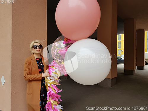 Image of Young fashion happy blonde woman with baloons ,fashion photo, instagram filter