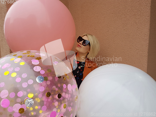 Image of Young fashion happy blonde woman with baloons ,fashion photo, instagram filter