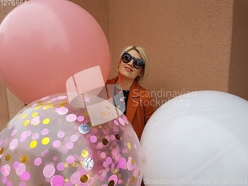 Image of Young fashion happy blonde woman with baloons ,fashion photo, instagram filter