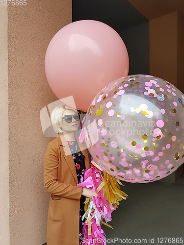 Image of Young fashion happy blonde woman with baloons ,fashion photo, instagram filter