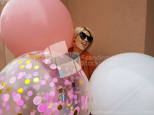 Image of Young fashion happy blonde woman with baloons ,fashion photo, instagram filter