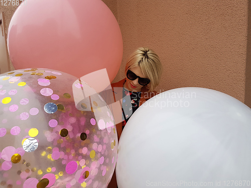 Image of Young fashion happy blonde woman with baloons ,fashion photo, instagram filter