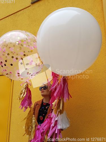 Image of Young fashion happy blonde woman with baloons ,fashion photo, instagram filter