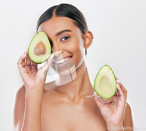 Image of Face, avocado and natural beauty, woman with organic cosmetics and facial on white background. Eco friendly skincare, healthy skin glow and female model in portrait, fruit and dermatology in studio