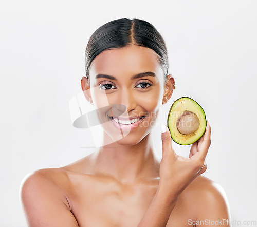 Image of Facial, avocado and natural beauty, woman with organic cosmetics isolated on white background. Eco friendly skincare, healthy skin glow and female model in portrait, fruit and dermatology in studio