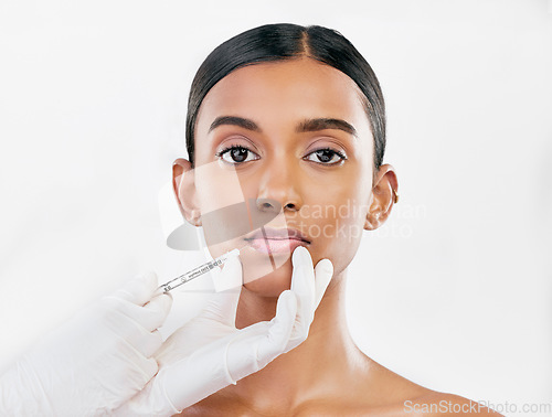 Image of Lip filler, woman and face with beauty, cosmetic treatment and injection for skincare on white background. Portrait, dermatology and hands with needle, female model and procedure with liquid collagen