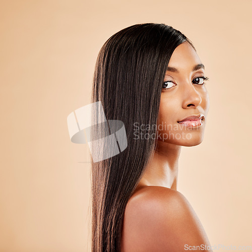 Image of Woman, portrait and haircare in beauty salon, cosmetics or skincare against a studio background. Female person with long hair posing in relax or satisfaction for keratin spa treatment on mockup space