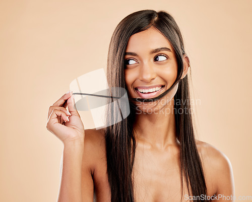 Image of Hair, beauty and smile, Indian woman with keratin treatment and shine isolated on studio background. Female model, cosmetics and haircare with salon hairstyle, skin and natural glow with dermatology