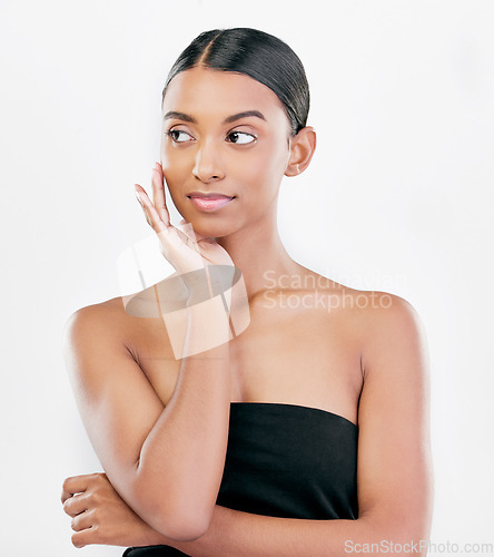 Image of Beauty, thinking and face of a woman with natural skin care isolated on a white background. Dermatology, makeup glow and cosmetics with Indian female model for facial shine and self love in studio