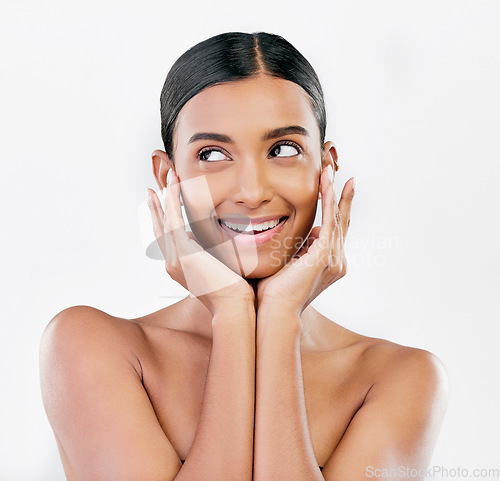 Image of Face, thinking and a woman with natural beauty, skin or glow isolated on a white background. Dermatology, makeup and cosmetics of Indian female model for facial shine, wellness or self care in studio