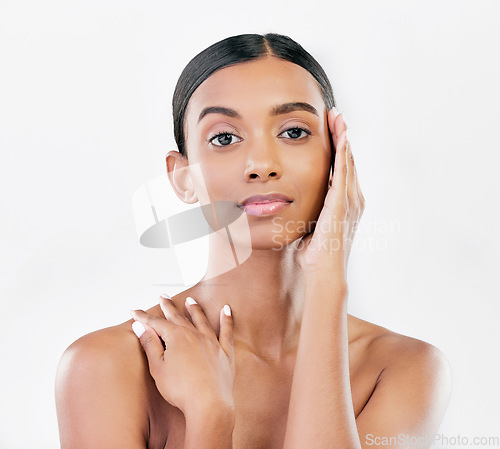 Image of Beauty, natural and face portrait of a woman with a skincare glow isolated on a white background. Dermatology, makeup and cosmetics of Indian person for facial shine, touch or self care in studio