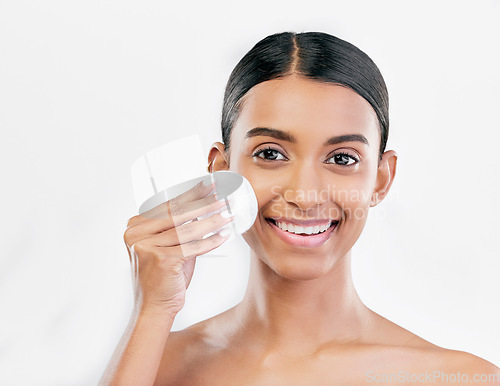 Image of Woman, face and cotton pad, beauty and makeup remover with skincare isolated on white background. Smile, portrait and dermatology, skin health and glow with young female model and clean facial