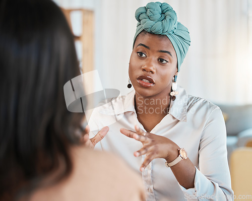 Image of Conversation, business people and meeting or interview in office with a black woman as leader. A serious African female entrepreneur with employee talking for advice, idea or communication at work