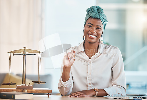 Image of Lawyer, portrait and happy black woman with glasses in office, law firm or workplace table. African attorney, face and smile of professional, employee or worker with legal advisor career in Nigeria.