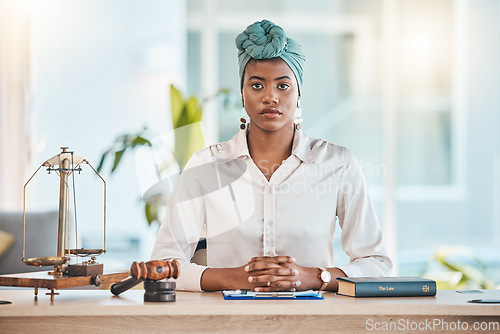 Image of Lawyer, portrait and serious black woman on table in office, law firm or workplace. African attorney, face and confident professional, employee or worker on desk for legal advisor career in Nigeria.