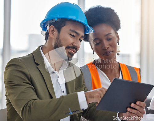 Image of Tablet, collaboration or planning with a construction worker and architect meeting in an office for a building project strategy. Technology, teamwork and a designer man talking to a woman colleague