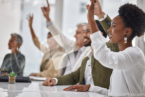 Image of Meeting, workshop and questions with business people hands raised in the boardroom during a strategy session. Planning, seminar and a group of colleagues or employees volunteering to answer at work