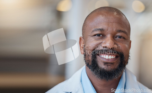 Image of Face, black man and happy doctor in hospital for healthcare, wellness and mockup space. African medical professional, portrait and surgeon, person or employee from Nigeria with smile for health bokeh