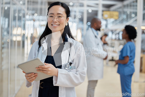 Image of Asian woman, doctor with tablet and portrait smile in hospital for healthcare, telehealth and research. Medical professional, face and surgeon, worker or employee with glasses for wellness technology