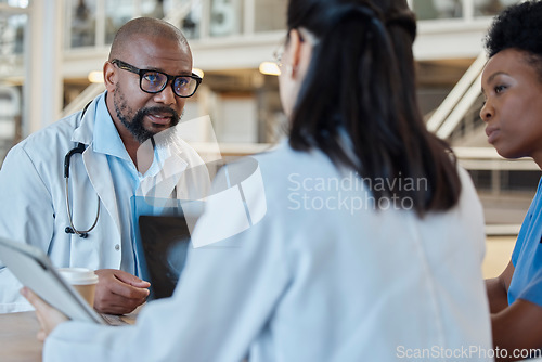 Image of Black man, radiology doctors and discussion with xray of test results, research and healthcare meeting. Medical team, surgeon and nursing staff planning surgery assessment for x ray report of anatomy