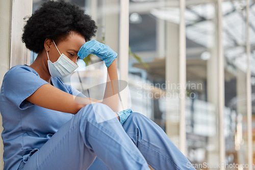 Image of Surgeon mental health, crying and black woman depressed about clinic news, hospital crisis or nurse mistake. Doctor, frustrated or African female nurse sad about healthcare risk, pain or sit on floor