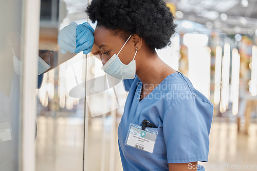 Image of Surgeon pain, depressed or black woman tired after medicine fail, hospital crisis or nurse mistake. Doctor, burnout or African female nurse overwhelmed with medical risk, anxiety or leaning on window