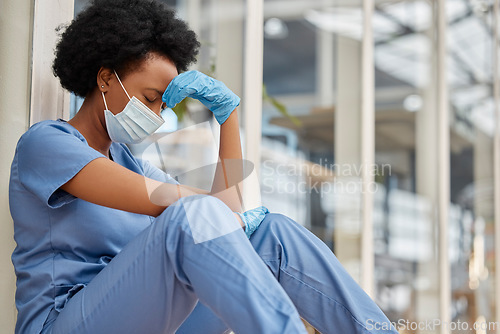 Image of Sad surgeon, crying and black woman depressed about clinic news, mental health problem or healthcare anxiety. Doctor, headache or African female nurse stress from medical risk, pain and sit on floor