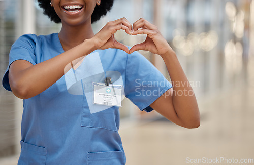 Image of Woman, nurse and heart hands for love, healthcare or passion in cardiology at the hospital. Hand of happy female person or medical professional show loving emoji, symbol or shape icon at the clinic