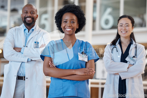 Image of Happy black woman, portrait and team of doctors in healthcare, hospital management or trust. Diversity group, medical employees and smile with arms crossed in collaboration, clinic or surgery support