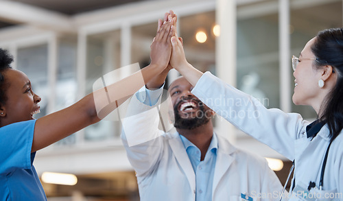 Image of High five, doctors and success of happy teamwork, unity and celebrate medical goals in clinic. Healthcare, excited group and join hands for celebration, cooperation and achievement of collaboration