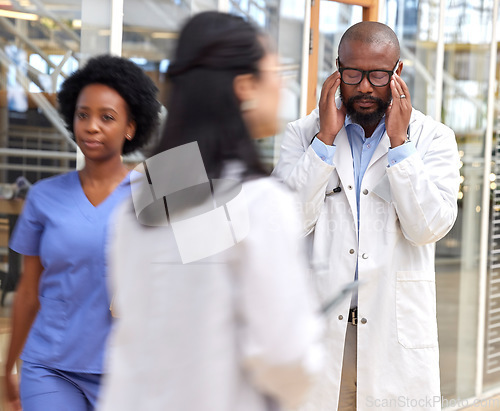 Image of Doctor headache, mental health problem or black man frustrated with service fail, hospital accident or crisis. Depressed, migraine or African person burnout from medical mistake, stress or healthcare