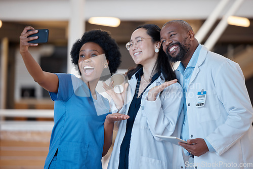 Image of Diversity, happy and group selfie of doctors, surgeon or emergency care workforce in hospital, clinic or medical facility. Asian woman, black woman nurse and African man smile for healthcare photo