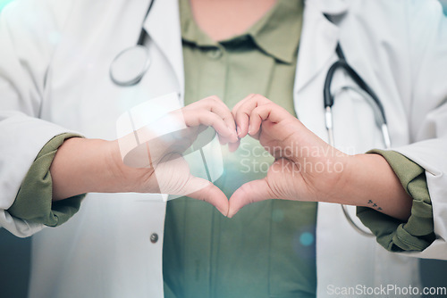 Image of Healthcare, professional and heart sign with woman in closeup for medicine or service. Medical expert, support and love hand for cardiology or hope and care with worker for wellness or insurance.