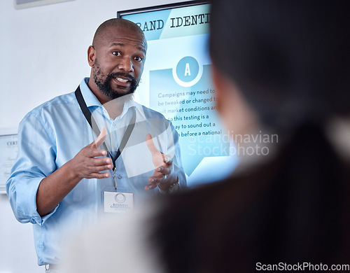 Image of Corporate, black man and leader with presentation, workshop and discussion with brand development. Male person, presenter and ceo with a vision, training and mentor with communication and education