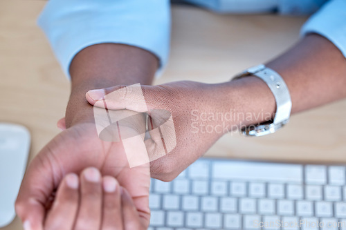 Image of Hand, wrist and joint pain by keyboard, closeup or carpal tunnel in workplace with stress, emergency or problem. Person, injury or arthritis with inflammation, osteoporosis or physical therapy at job