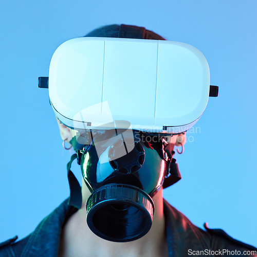 Image of Woman, vr glasses and face mask in studio for user experience, gaming or 4d movie by blue background. Girl, augmented reality and tech for gas, scent and video with app, digital world and fantasy ux