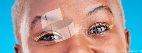 Image of Makeup portrait, eyeliner and eyes of black woman with studio beauty, wellness and facial cosmetics for skincare shine. Mascara, cosmetology design and closeup African person on blue background.