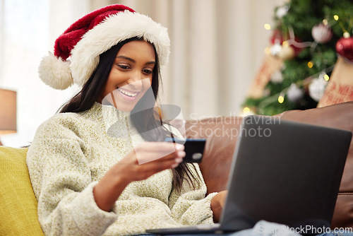 Image of Woman, laptop and credit card, e commerce and Christmas shopping, online payment for gift and bank app. Female person on sofa, internet banking on pc and finance, fintech and holiday donation at home