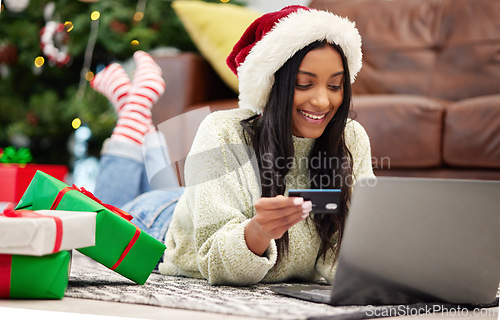 Image of Christmas, online shopping and woman with laptop, credit card for payment for gift with internet banking. Female customer, smile for holiday donation and ecommerce for present, fintech and bank app