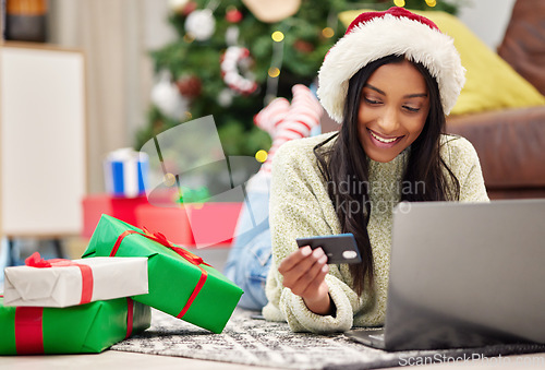 Image of Christmas, e commerce and woman with laptop, credit card for online payment for gift with internet banking. Female customer, smile for holiday donation or shopping for present, fintech and bank app