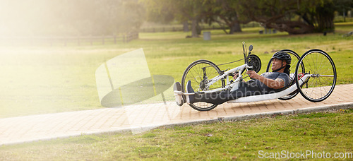 Image of Cycling, fitness and space with man and handcycle in nature for training, sports contest and challenge. Exercise, workout and banner with person with a disability in park for cardio and health mockup