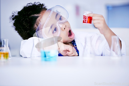 Image of Child, science and chemistry with wow chemical in a laboratory for test or research. Face of African kid student shock or surprised for scientist, future education or learning experiment in class