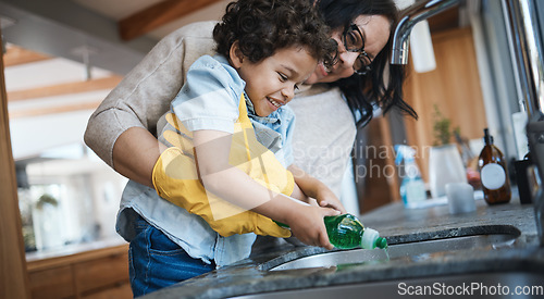 Image of Washing, dishes and mother with child in kitchen for learning housework, teaching and helping with chores. Housekeeping, happy family and mom and boy with soap for cleaning, hygiene and development